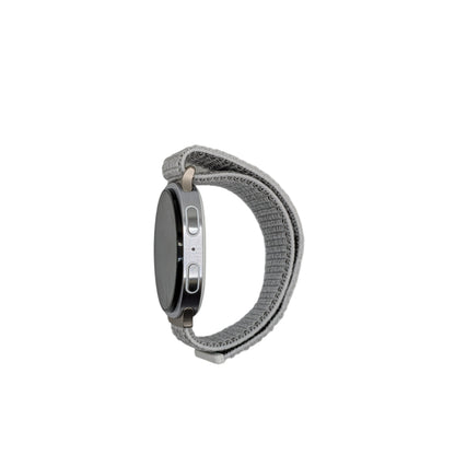 Smartwatch with a metallic band on a light gray background